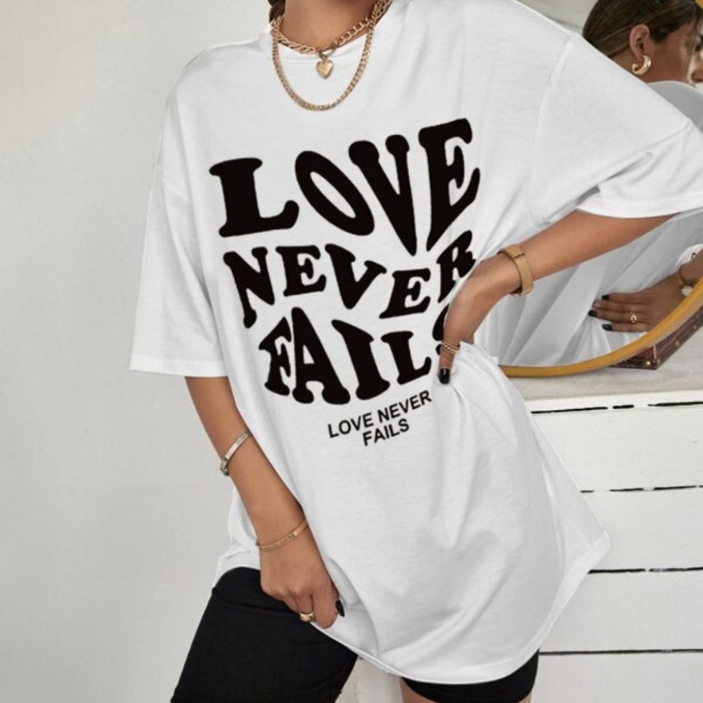 LOVE NEVER FAILS OVERSIZED TEE WHITE